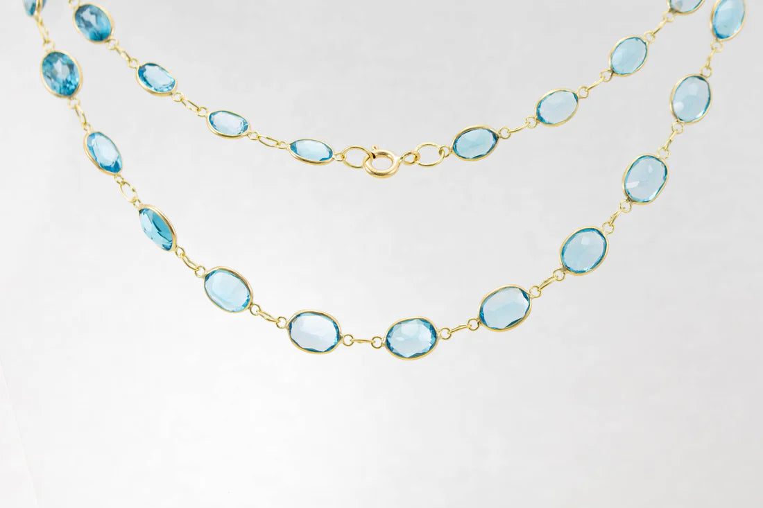 trendy gold necklaces for women -9ct Yellow Gold Blue Topaz Graduated Line Necklace